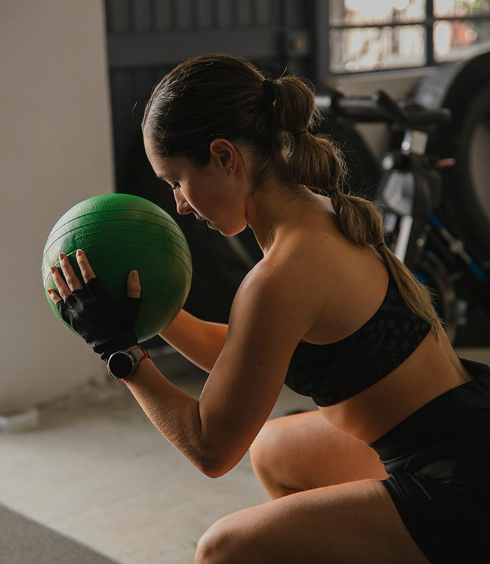 Person exercising with medicine ball.