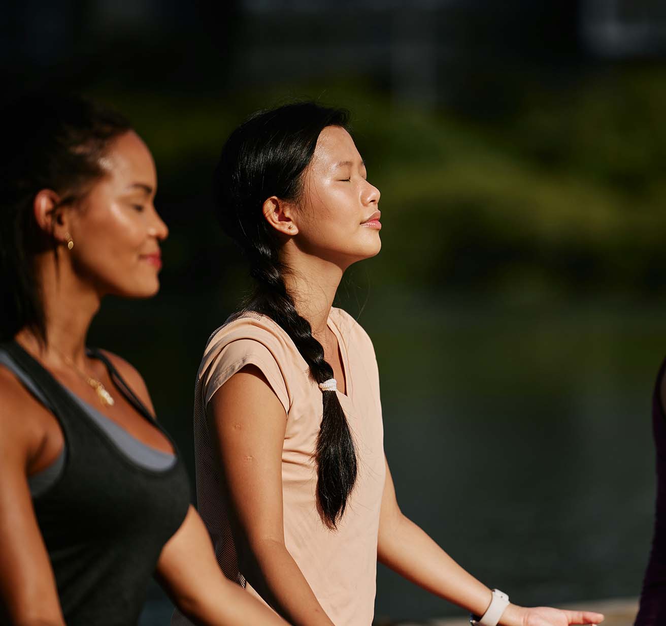 People meditating outside.